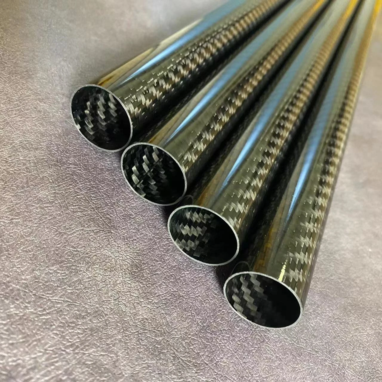 roll wrapped carbon fiber tubes