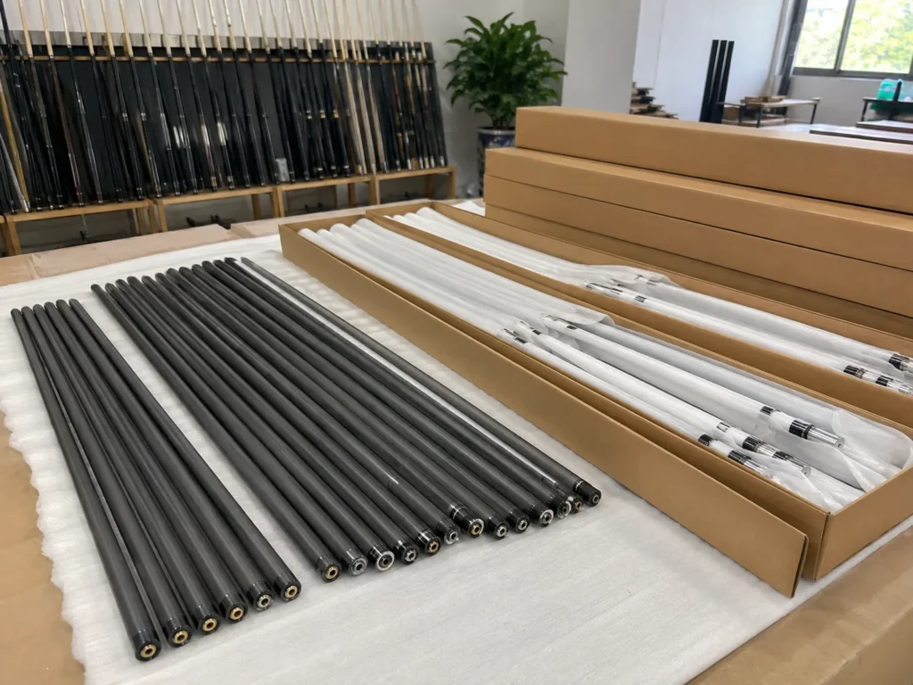 Carbon fiber cue shaft samples, packaging, and design notes prepared for private-label brand development.